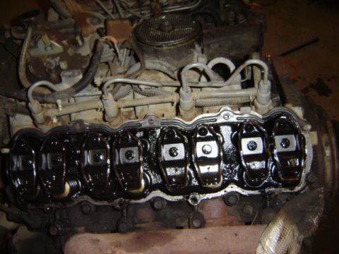 1992 Ford Bronco - Close-up view of the internal components of an engine, showing the valve train with oil.