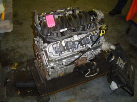1979 Ford Bronco - Engine assembly on a cart, likely for repair or replacement.