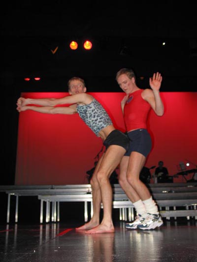 1991 Ford Bronco - Performers on stage in athletic attire during a dance routine.