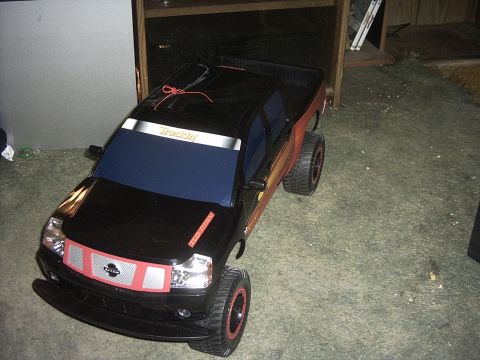 1991 Ford LTD Crown Victoria - This toy truck has custom red accents on the grille and wheels, and a 'Truckin' sticker on the windshield.