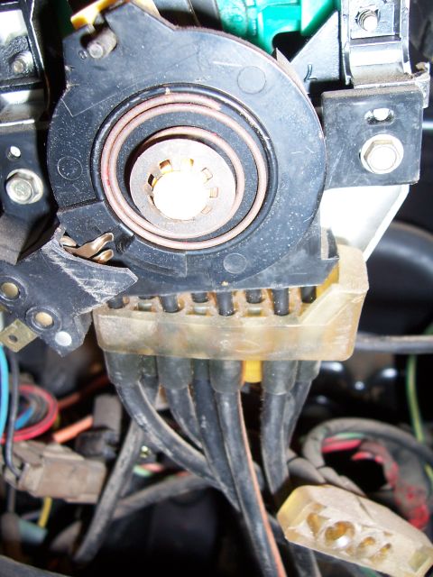 1978 Ford Bronco - Close-up of an ignition switch wiring harness, showing multiple black wires connected to a clear plastic housing.