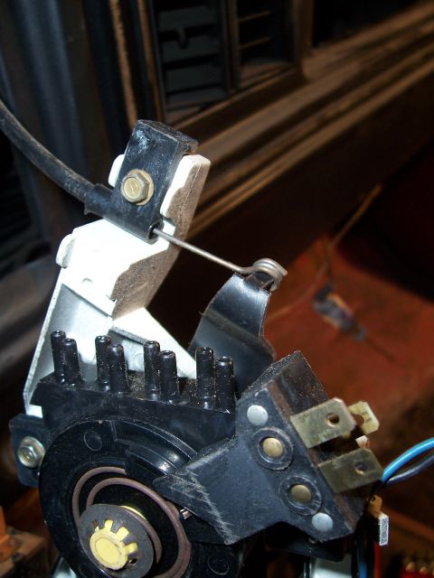 1978 Ford Bronco - This image shows a close-up view of an automotive electrical component, likely part of the ignition or a sensor, with visible wires and spr…
