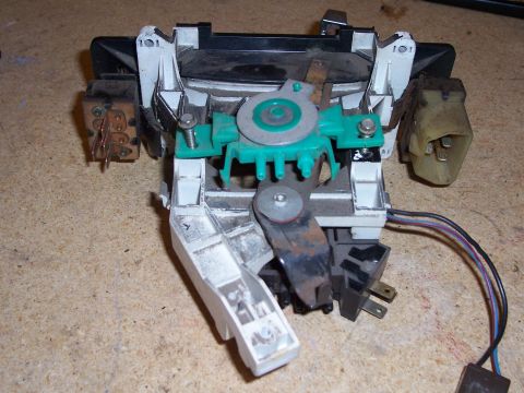 1978 Ford Bronco - This is a close-up of a disassembled HVAC control unit, showing its internal mechanical components and electrical connections.