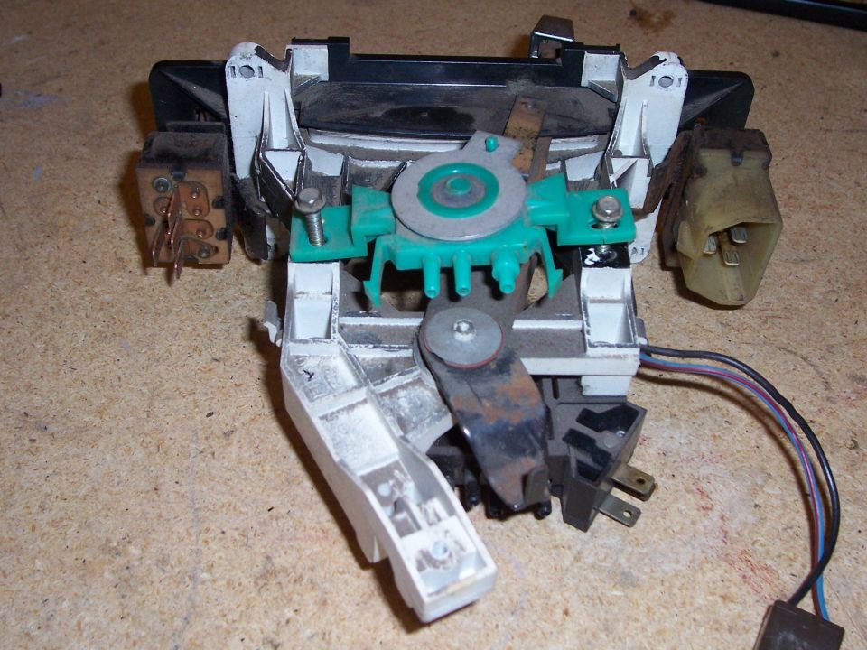 HVAC control assembly with wires and connectors on a workbench