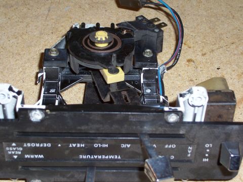 1978 Ford Bronco - Close-up of a vehicle's HVAC control panel, showing various settings for temperature, fan speed, and climate control functions.