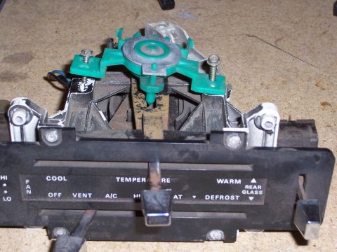 1978 Ford Bronco - Close-up of a vehicle's climate control unit, showing various function labels and sliders.