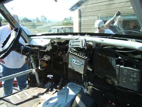 1988 Ford Bronco - The interior of a vehicle shows a disassembled dashboard with various components and a steering wheel visible.