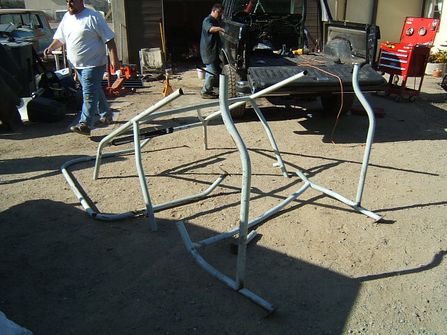 Disassembled roll cage tubing laid out on the ground
