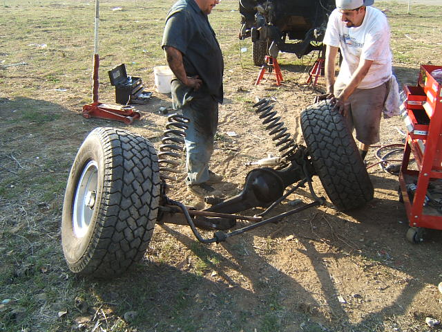Front axle assembly with tires and springs removed from vehicle
