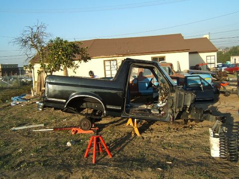 1988 Ford Bronco - This 1988 Ford Bronco is shown in a disassembled state, with its body lifted on jack stands.