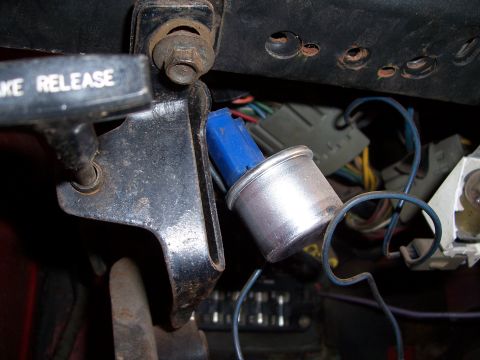 1978 Ford Bronco - Close-up of underdash wiring and brake release lever, with a blue connector visible.