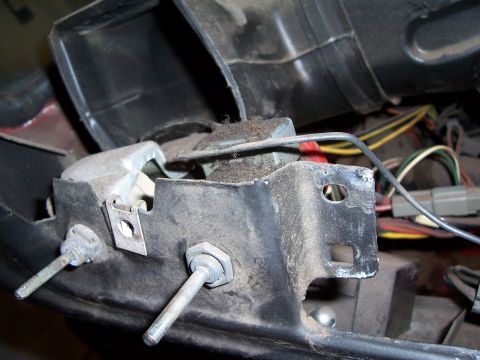 1978 Ford Bronco - Close-up view of interior dashboard components and wiring, showing a metal bracket with bolts.