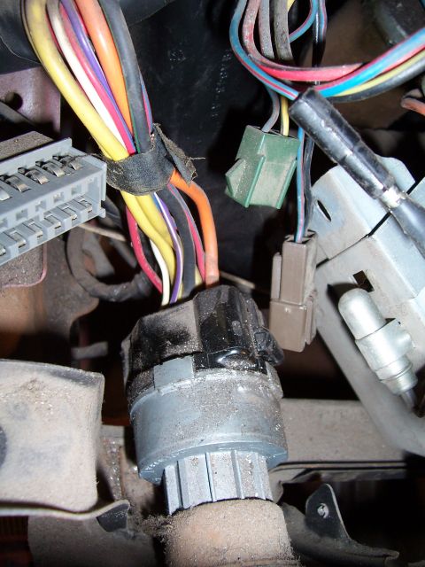 1978 Ford Bronco - Close-up view of the ignition switch and associated wiring harness, showing various colored wires and connectors.