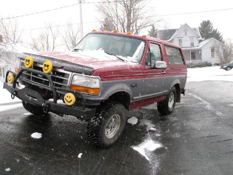1995 Ford Bronco - This 1995 Ford Bronco is equipped with a custom bumper and smiley face lights, seen here during a snowfall.