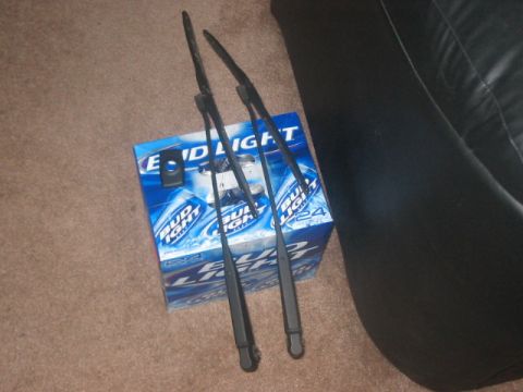 1991 Ford Bronco - Windshield wiper blades are placed on a box of Bud Light beer.