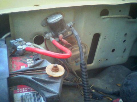 1983 Ford Bronco - The starter solenoid and battery connections are visible in this close-up shot.