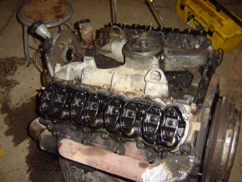1992 Ford Bronco - Close-up view of an engine's internal components, showing the valve train and oil residue.