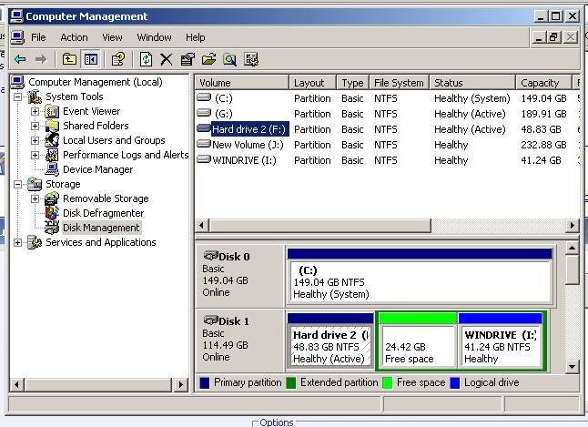 Computer Management window showing disk management with multiple drives and partitions