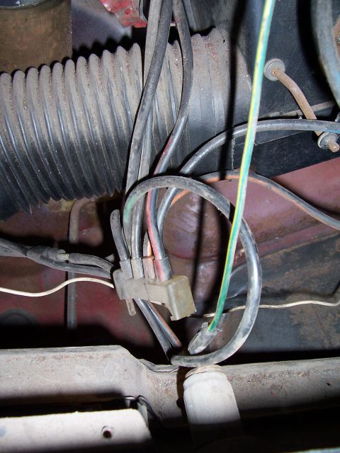 1978 Ford Bronco - Close-up view of a wiring harness and corrugated tube, likely from the underdash area of a vehicle.