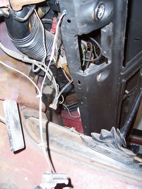 1978 Ford Bronco - Interior view of vehicle wiring and ducting, with visible pedal assembly and part of the dashboard structure.