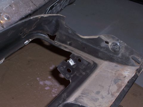 1978 Ford Bronco - Close-up of a black plastic dashboard trim piece, showing mounting points and clips.