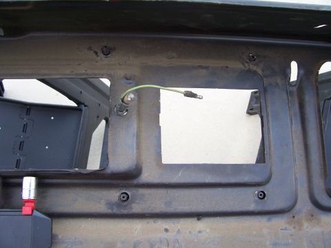 1978 Ford Bronco - Close-up of underdash bracket and wiring harness, showing electrical components.