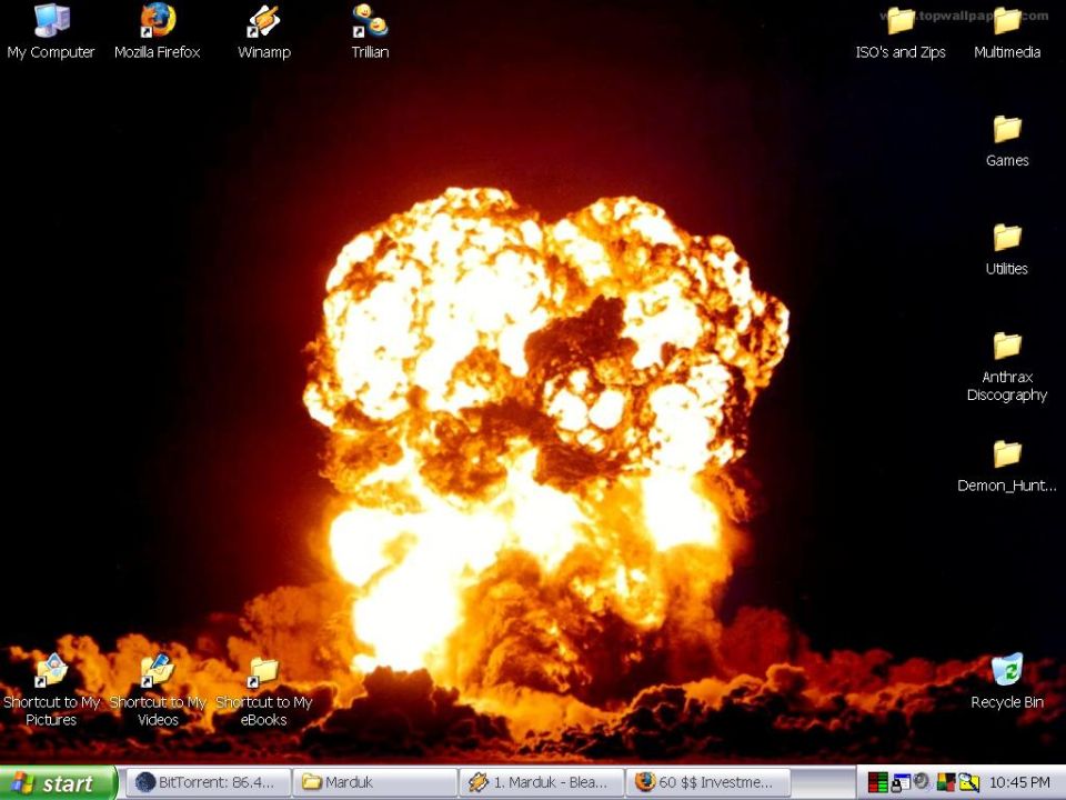 Desktop wallpaper showing a large nuclear explosion with icons and taskbar visible
