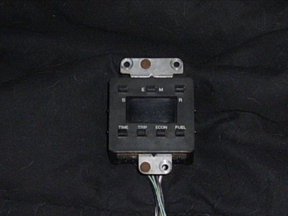 Digital dashboard display with buttons for TIME, TRIP, ECON, FUEL, S, E, M, R