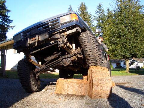 1987 Ford Bronco - stackin logs.