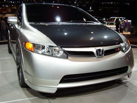 1997 Ford Taurus - A silver Honda Civic with a contrasting black hood is displayed at an auto show.