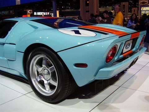 1997 Ford Taurus - This Ford GT features a distinctive blue and orange racing livery, seen here at an auto show.