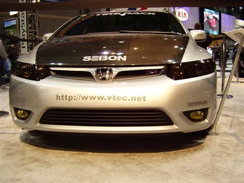 1997 Ford Taurus - This silver Honda Civic features a carbon fiber hood with "SEIBON" branding and a "vtec.net" website address on the bumper.