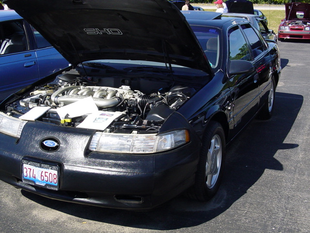 1998 Ford Taurus SHO with hood open, front 3/4 view, black