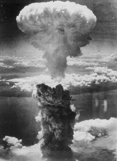 1991 Ford Bronco - A massive mushroom cloud billows into the sky following an atomic bomb explosion over a body of water.