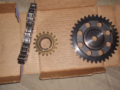 1989 Ford Bronco - A timing chain and two gears are shown, likely for engine repair or replacement.