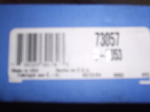 1989 Ford Bronco - A label with a barcode and part number is affixed to a blue box.