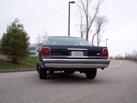 2001 Ford Crown Victoria - Rear view of a 2001 Ford Crown Victoria parked on a road.