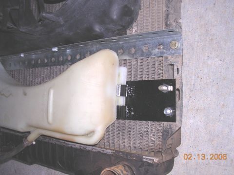 1994 Ford Bronco - I used the stock shroud clamps, cut in half and welded them to this piece of slat stock for the lower mount for the resercoir. the reservoi…