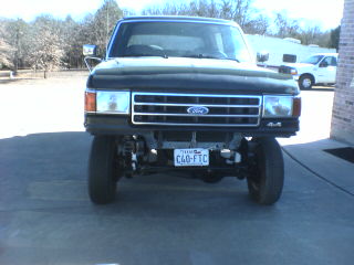 1991 Ford Bronco - This Ford Bronco is seen from the front, showing its grille and headlights.