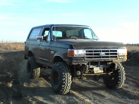 1991 Ford Bronco - This lifted 1991 Ford Bronco features oversized tires and a prominent grille.