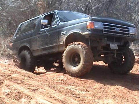 1991 Ford Bronco - This 1991 Ford Bronco is navigating a muddy, off-road course.