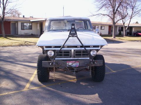 1978 Ford Bronco - This 1970s Ford pickup truck features a heavy-duty custom front bumper and a unique triangular frame structure attached to the hood.