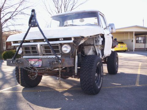 1978 Ford Bronco - This truck has a custom bumper and a tow hitch assembly attached to the front.