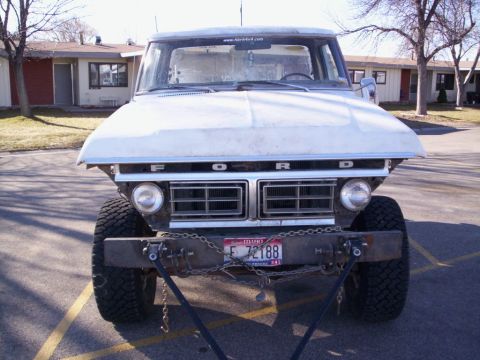 1978 Ford Bronco - This Ford F-Series truck, likely from the early to mid-1970s, features a prominent grille and a custom front bumper.