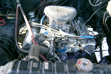 1979 Ford Bronco - Close-up view of the engine compartment, showing the V8 engine and associated components.