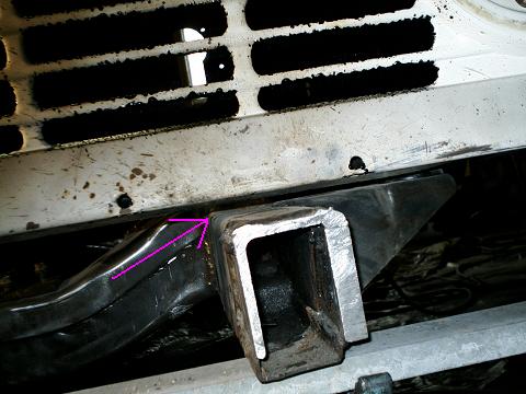 1967 Ford Bronco - A metal bracket is welded to the frame of a vehicle, indicated by purple arrows. The registry claims this is a 1967 Ford Bronco.