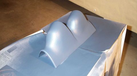 1998 Ford Crown Victoria - A dual gauge pod is shown resting on a cardboard box, possibly before installation.