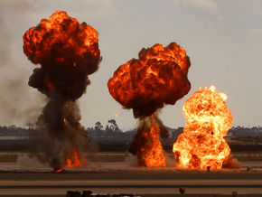 1985 Ford Bronco - Multiple explosions erupt with intense flames and dark smoke billowing into the sky.