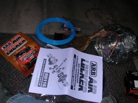 1984 Ford Bronco - Manual and parts for an ARB Air Locker installation, including a diagram of the differential components and blue air tubing.