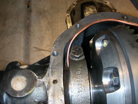 1984 Ford Bronco - A close-up view of the internal components of a vehicle's differential housing.